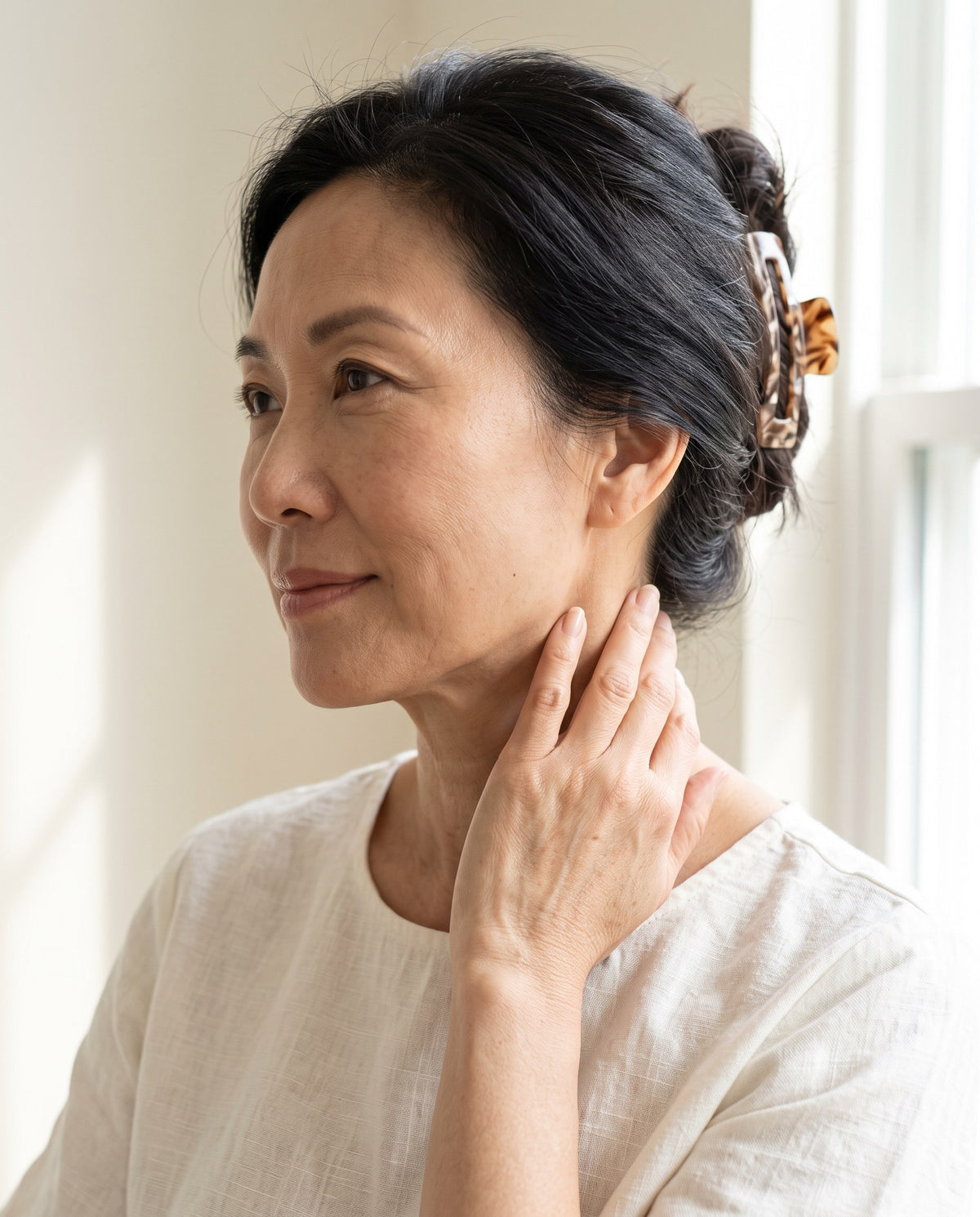 Firmer-looking jaw and neck.